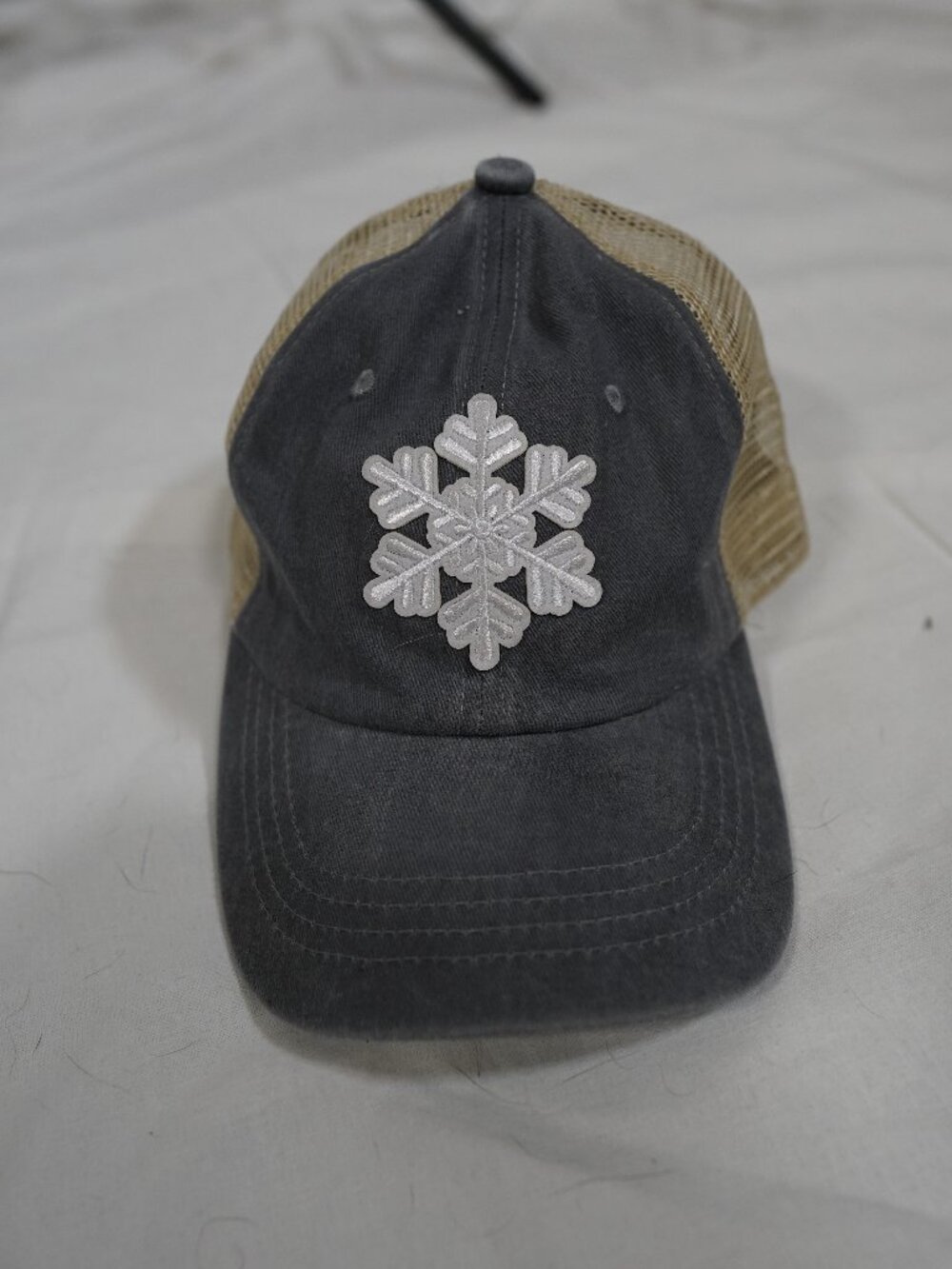 Gray Tan Mesh Trucker Hat White Snowflake Patch Distressed Winter Cap